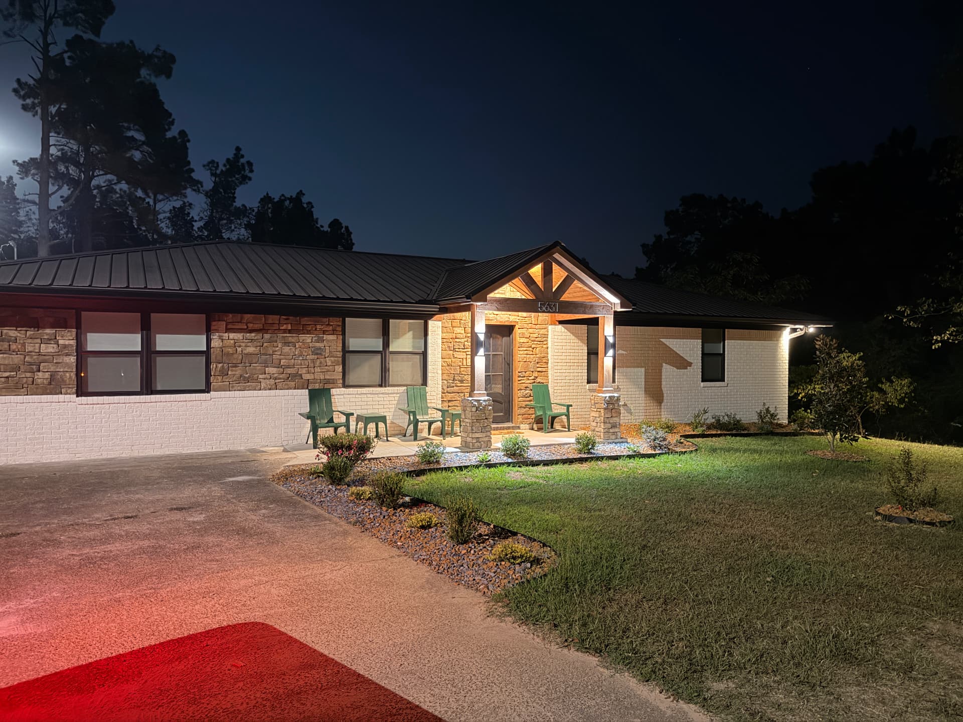 Cedarstone Retreat front entry lit up at night