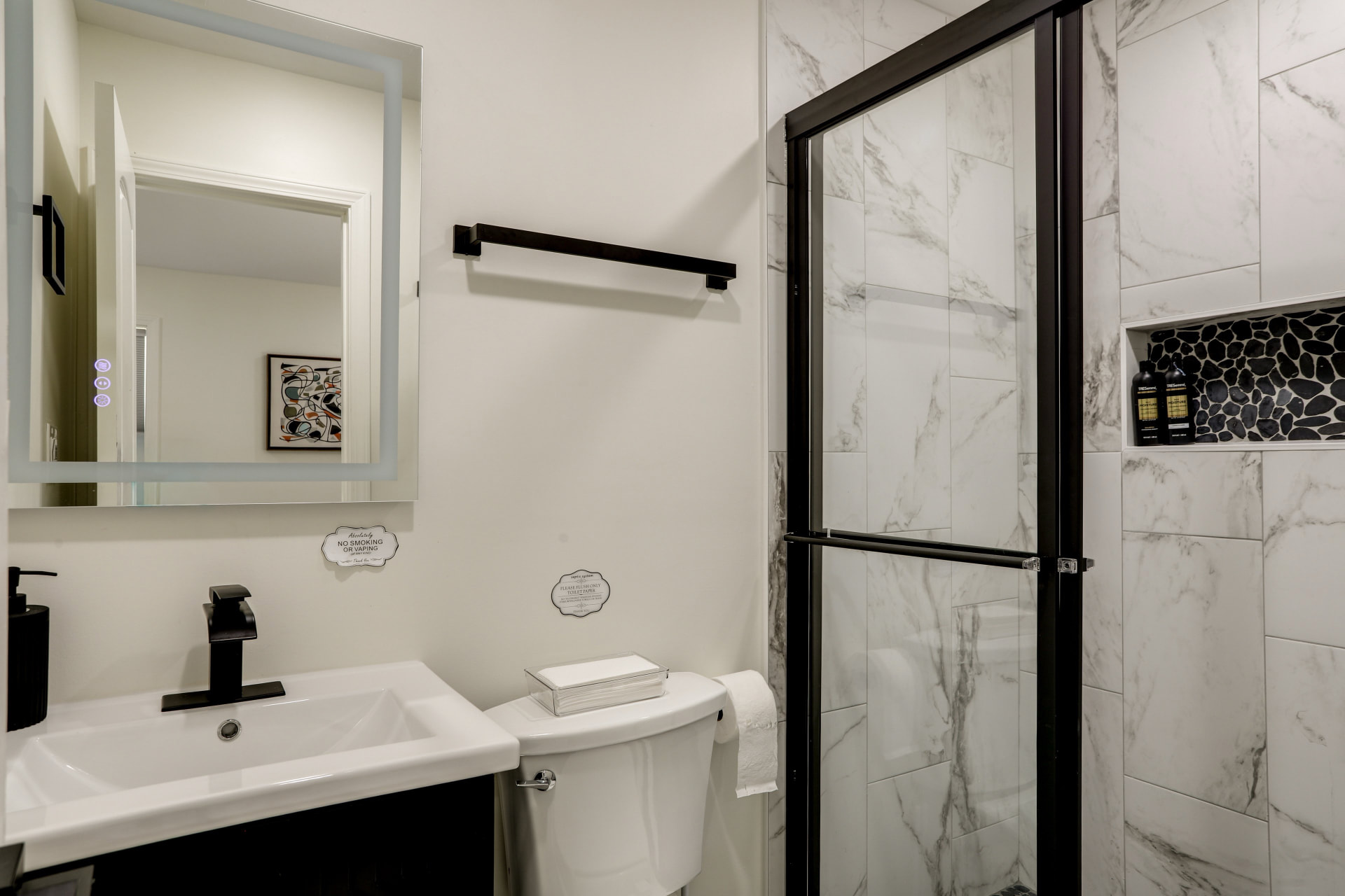 Guest bath at Cedarstone Retreat with a marble-look tiled walk-in shower